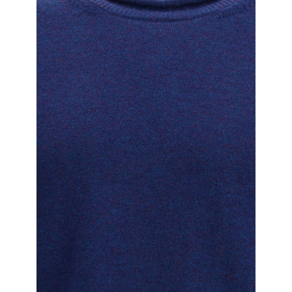 Comme Des Garçons Blue Wool Sweatshirt with ribbed knit texture, featuring a round neckline and long sleeves for a contemporary elegant style.