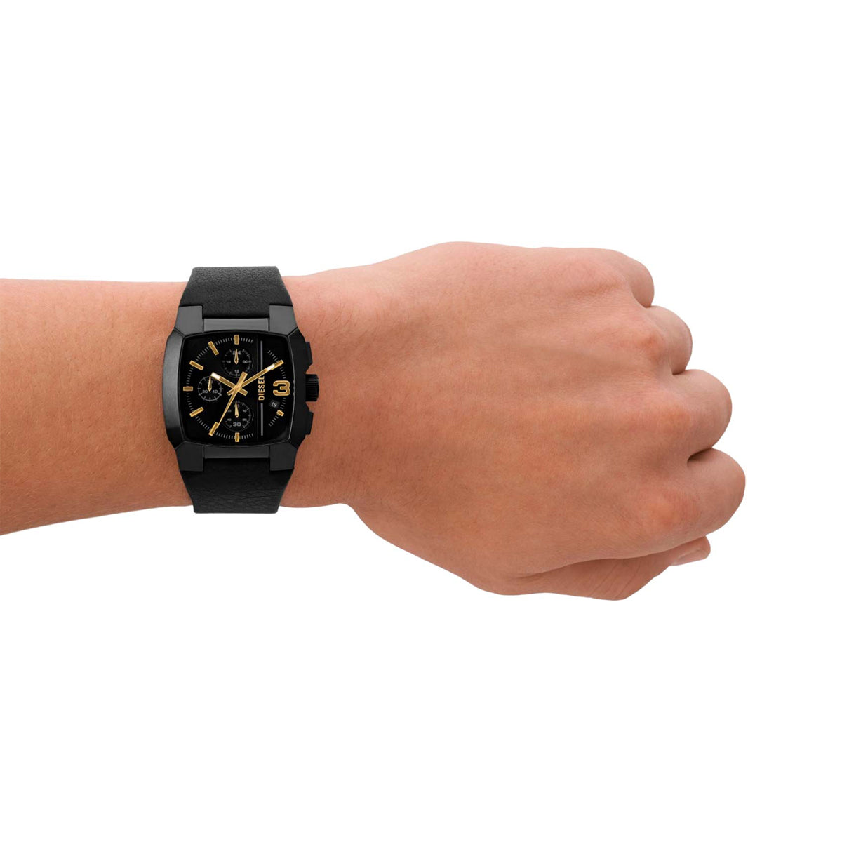 Person wearing DIESEL Mod. CLIFFHANGER wristwatch with black leather strap and 40mm SS IP brown case on left wrist, showing watch face detail.