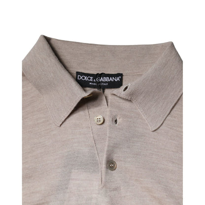 Close-up of Dolce & Gabbana Beige Cashmere Knit Collared Pullover Sweater with buttons and logo