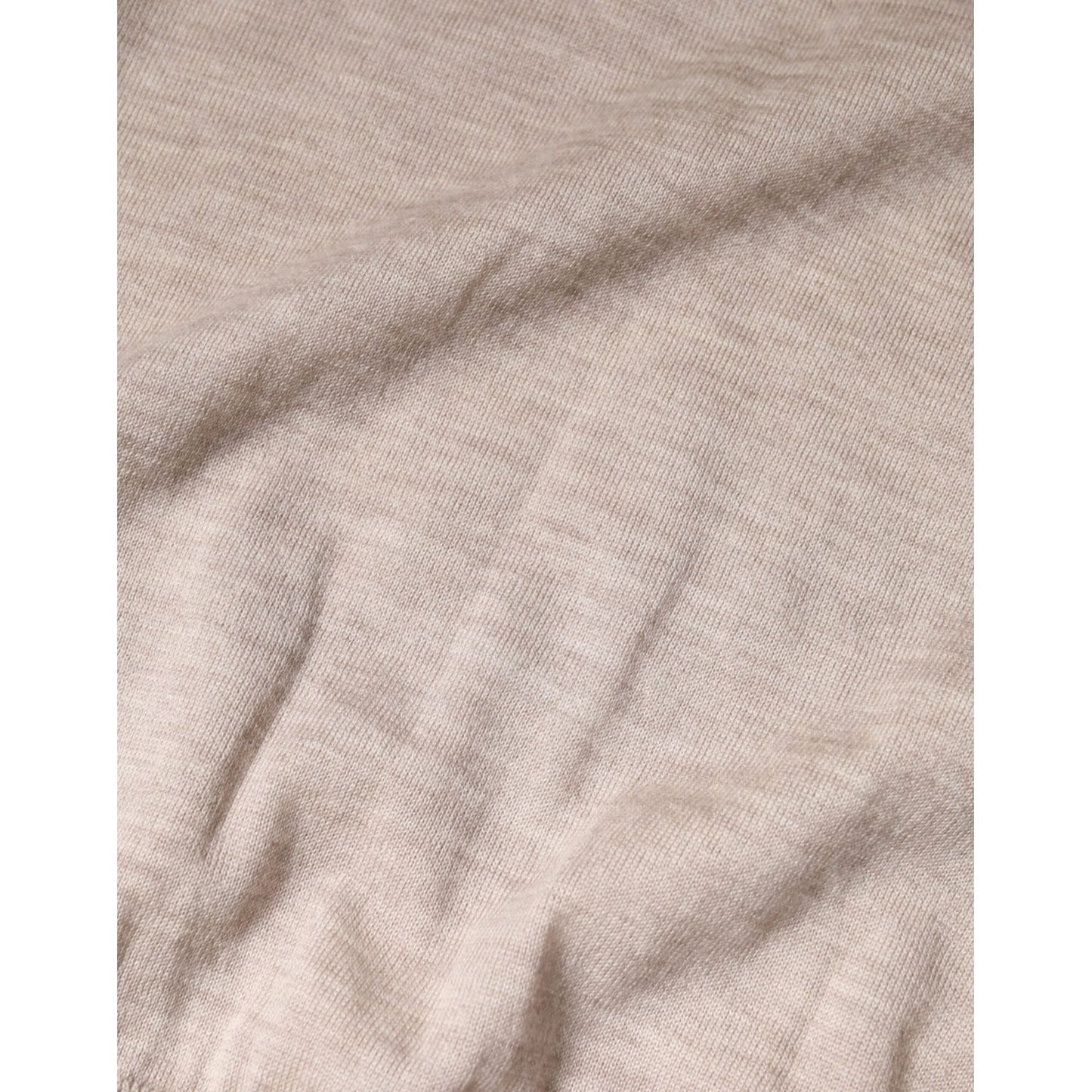 Close-up of Dolce & Gabbana Beige Cashmere Knit Collared Pullover Sweater fabric texture.