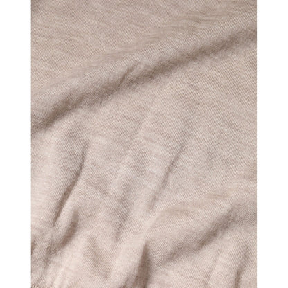 Close-up of Dolce & Gabbana Beige Cashmere Knit Collared Pullover Sweater fabric texture.
