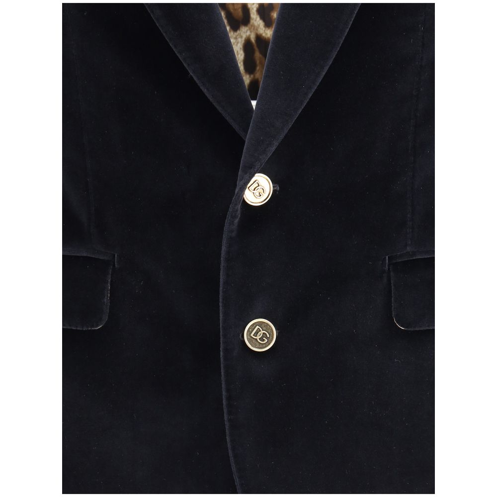 Dolce & Gabbana Black Cotton Blazer with gold button closure and leopard lining, featuring elegant velvet fabric and classic silhouette.