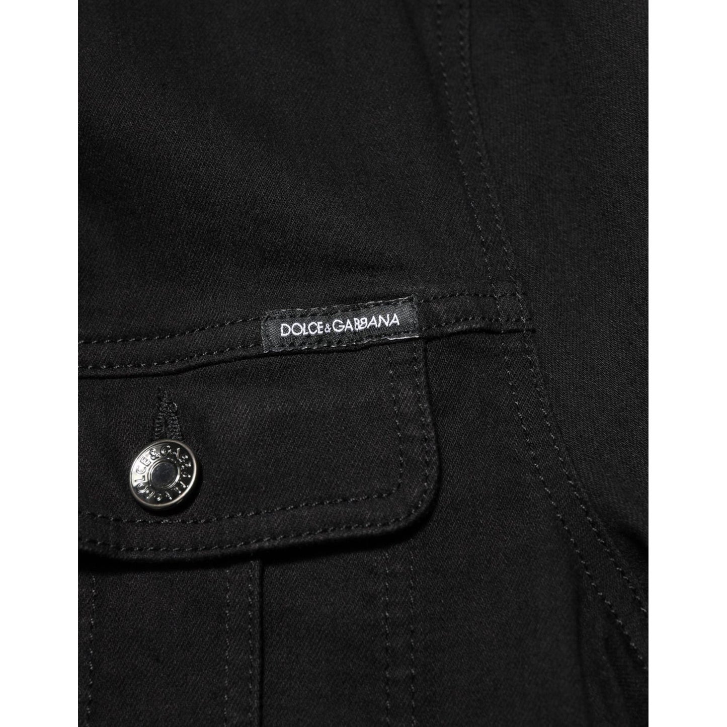 Close-up of Dolce & Gabbana Black Cotton Denim Stretch Button Up Jacket with pocket and logo detail.