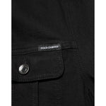 Close-up of Dolce & Gabbana Black Cotton Denim Stretch Button Up Jacket with pocket and logo detail.