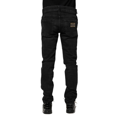 Dolce & Gabbana Black Cotton Skinny Men Denim Jeans featuring a regular fit with zipper and button closure, rear view.