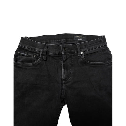Dolce & Gabbana Black Cotton Skinny Men Denim Jeans with button closure and logo details, made in Italy.