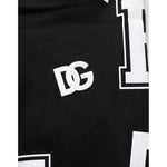 Dolce & Gabbana Black Logo Print Cotton Casual Bermuda Short with stylish white DG logo design on black fabric background.