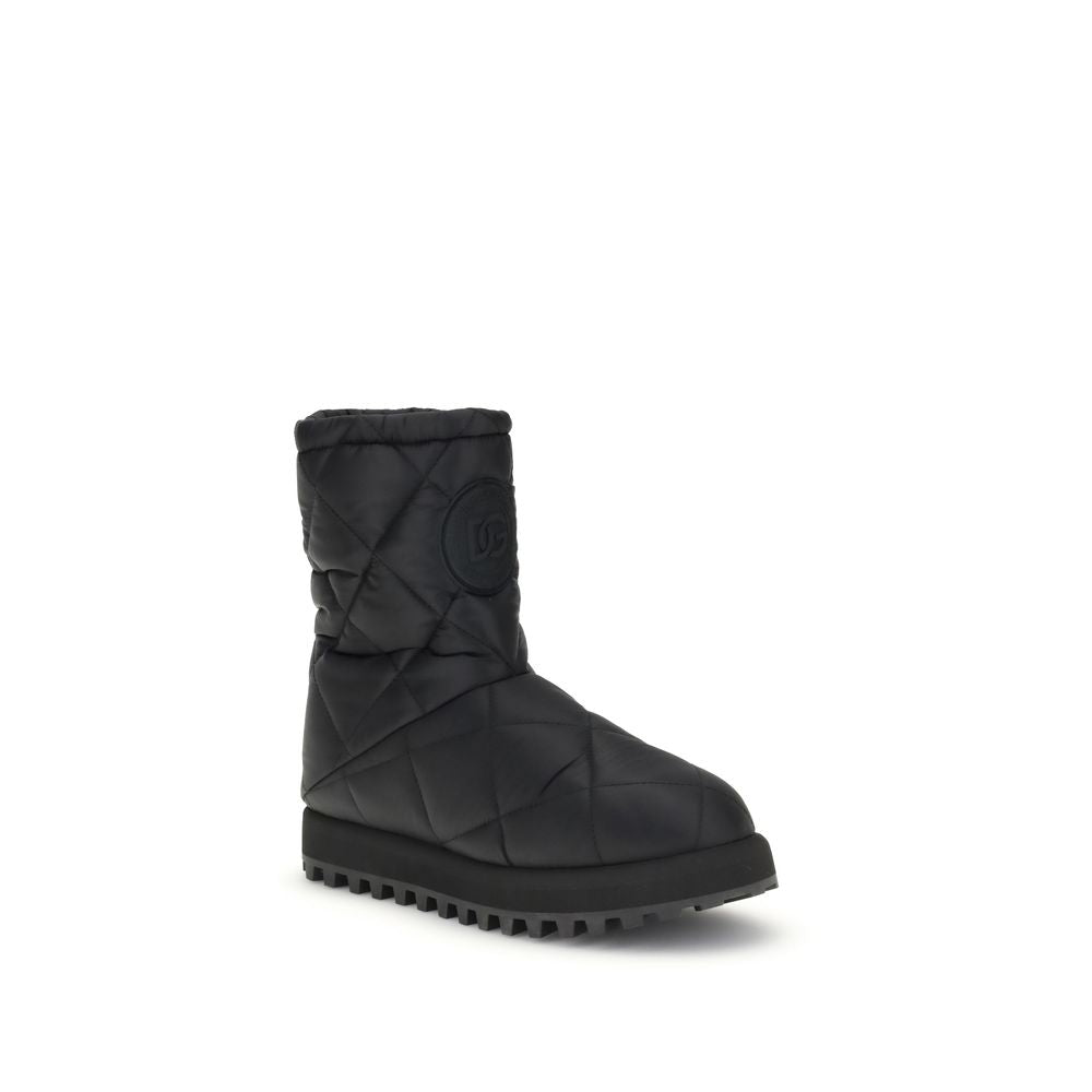 Dolce & Gabbana Black Polyamide Flat Boots with quilted diamond design and rubber lug sole, featuring iconic logo patch.