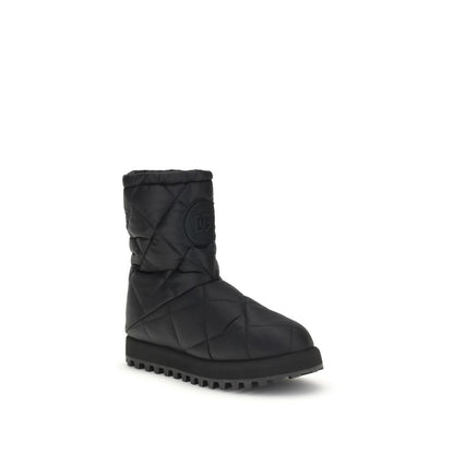 Dolce & Gabbana Black Polyamide Flat Boots with quilted diamond design and rubber lug sole, featuring iconic logo patch.