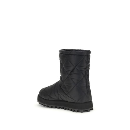 Dolce & Gabbana Black Polyamide Flat Boots with quilted diamond pattern, round toe, and rubber lug sole for grip and durability.