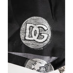 Close-up of Dolce & Gabbana Black Silk Ancient Coin Print Boxer Short Swimwear showcasing logo detail and coin design.