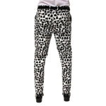 Back view of Dolce & Gabbana Black White Abstract Print Cotton Blend Pants with tailored fit and artistic design.