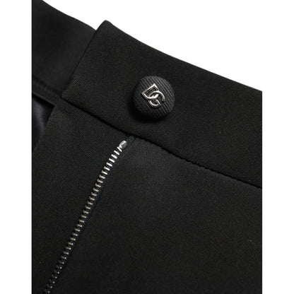 Close-up of Dolce & Gabbana Black Wool Stretch High Waist Skinny Pants with zipper and logo button detail.