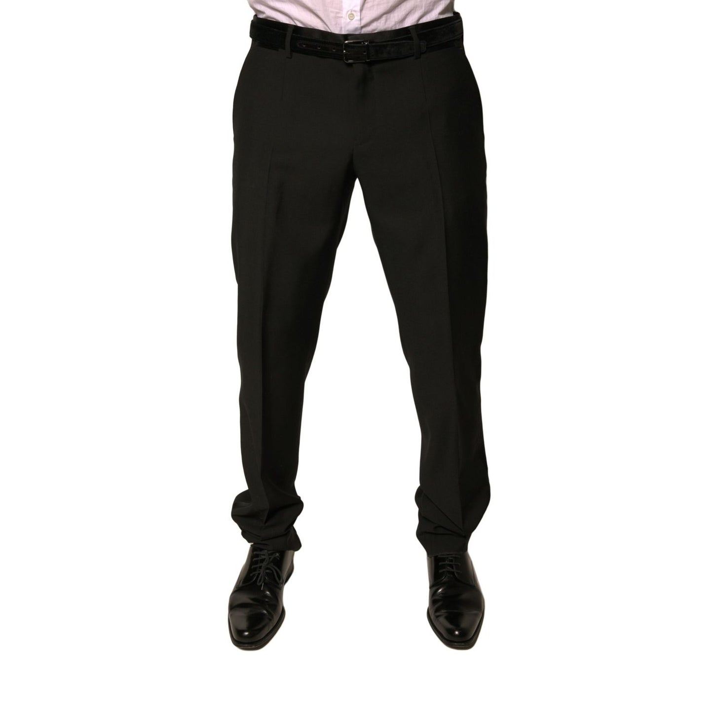 Man wearing Dolce & Gabbana Black Wool Tapered Formal Dress Pants with button and zipper closure, mid waist design, made in Italy.