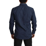 Back view of a man wearing a Dolce & Gabbana Blue Cotton MARTINI Slim Fit Dress Shirt