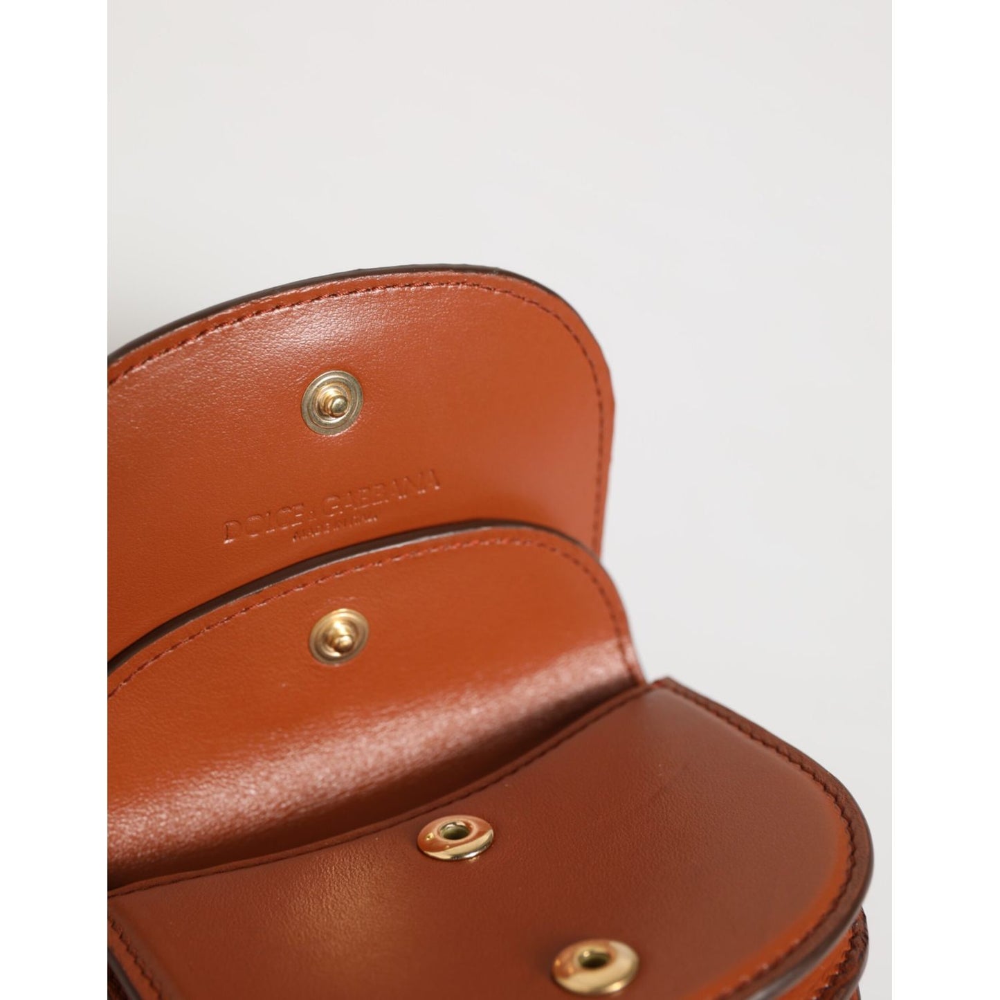Interior view of Dolce & Gabbana Brown Leopard Print Calf Leather Small Coin Purse Wallet with snap closure and smooth brown lining.