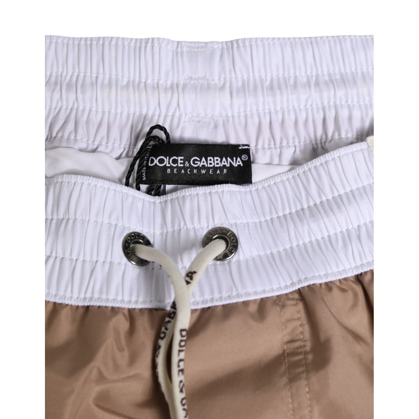 Dolce & Gabbana Brown White Polyester Re-Edition Shorts Swimwear, close-up of waistband with logo and drawstring detail.