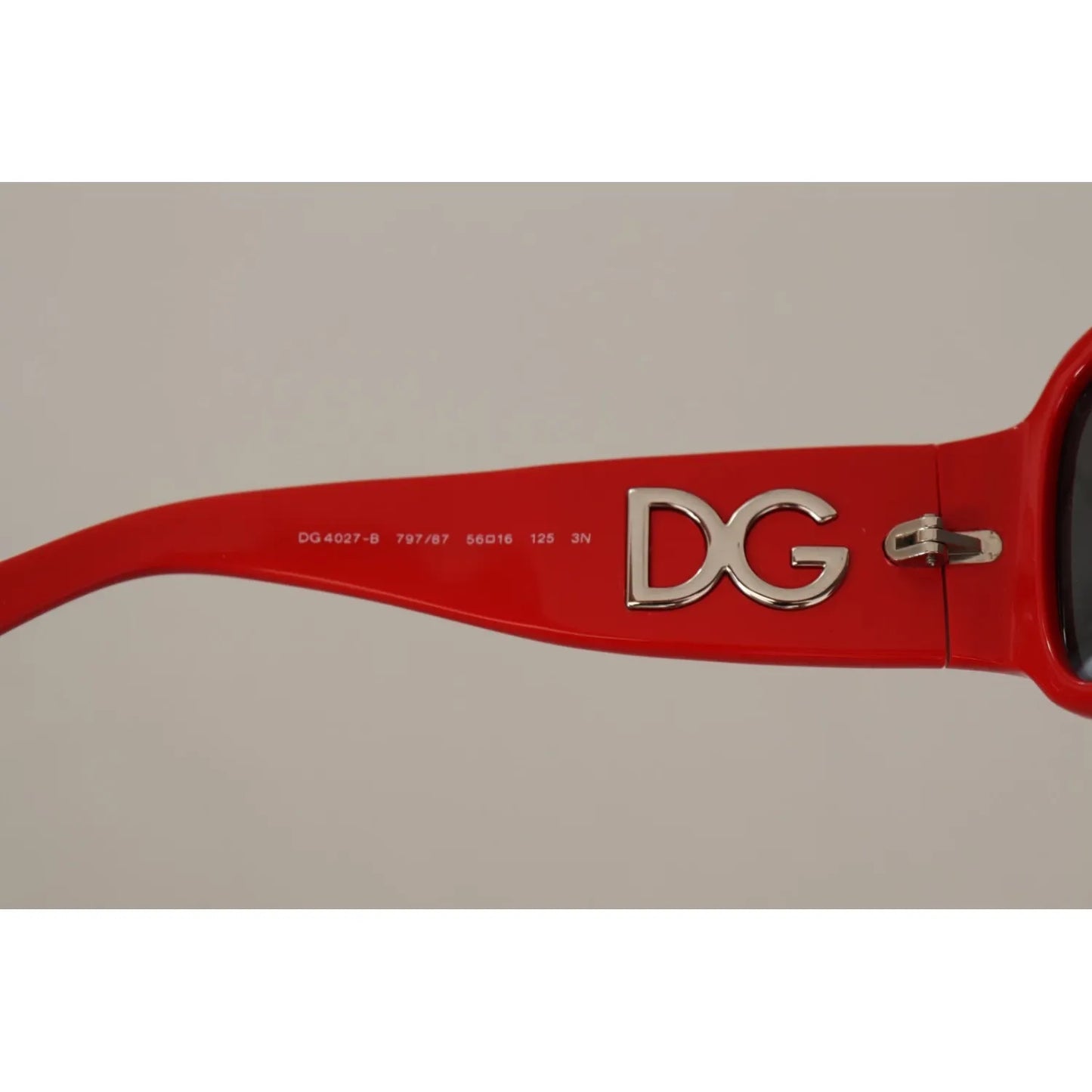 Dolce & Gabbana DG4027 Red Crystal Black Lens Shades Sunglasses side view with DG logo on red frame.