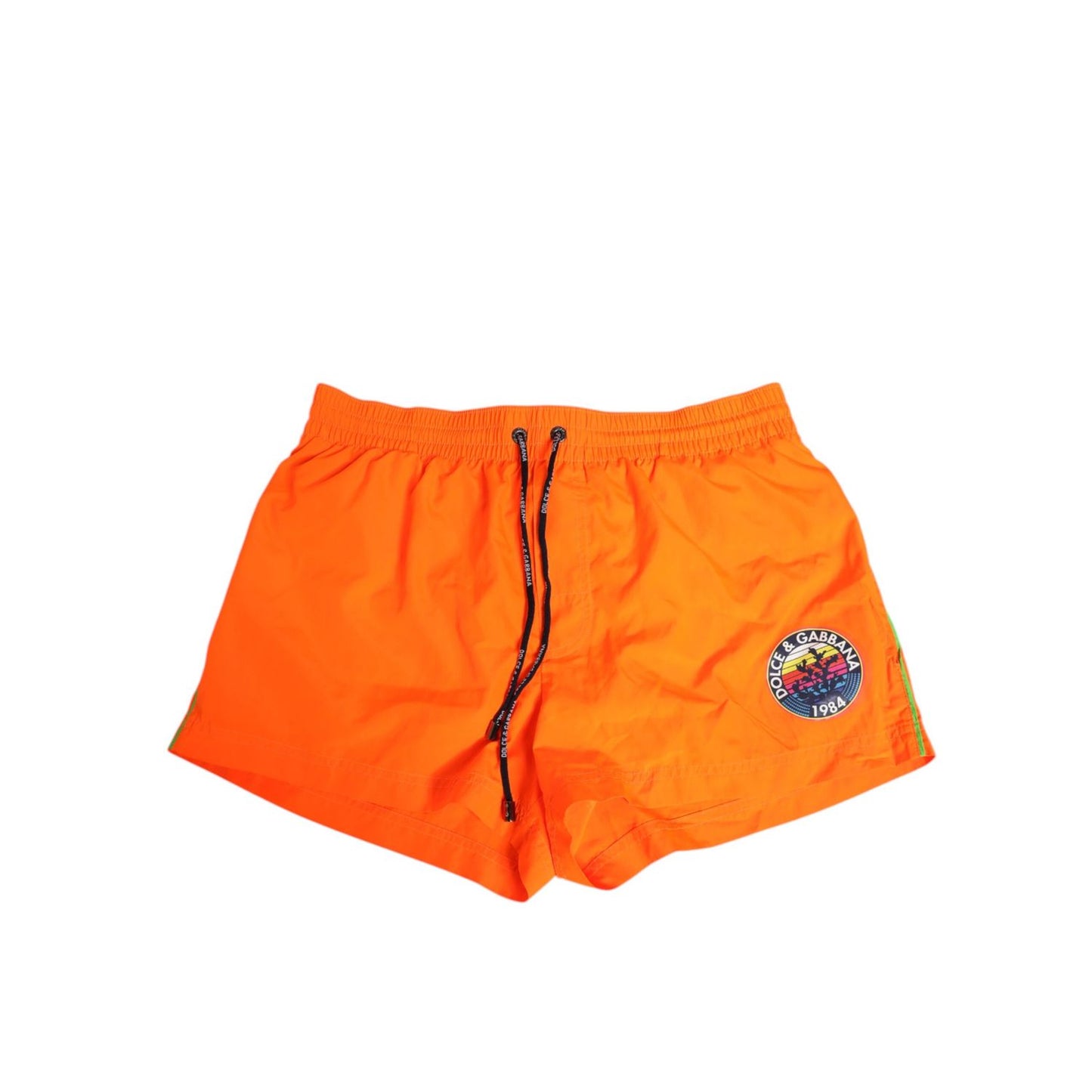 Dolce & Gabbana Orange Polyester Beachwear Men Shorts Swimwear with logo, drawstring waistband, and zip pocket.