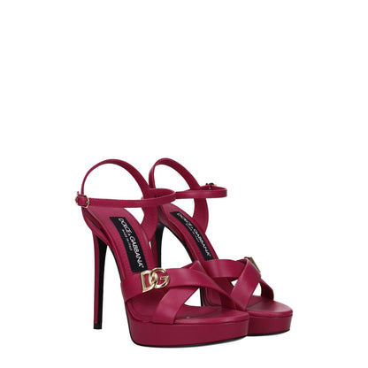 Dolce & Gabbana Pink Leather Platform Sandals with gold logo and buckle closure, featuring high heels and open toe design.