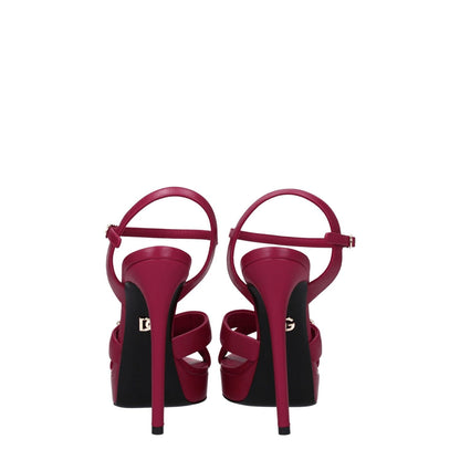Back view of Dolce & Gabbana Pink Leather Platform Sandals with buckle closure, high heel, and logo detail.