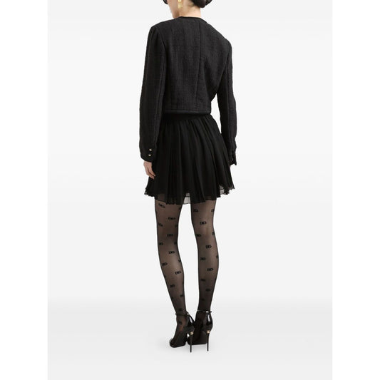 Back view of model wearing Dolce & Gabbana Rachel Tweed Jacket with front button fastening and four patch pockets