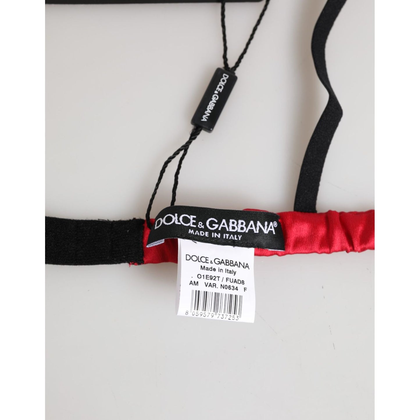 Close-up of Dolce & Gabbana Red Silk Satin Triangle Soft Cup Br Underwear with black and red details, tags, and logo visible.