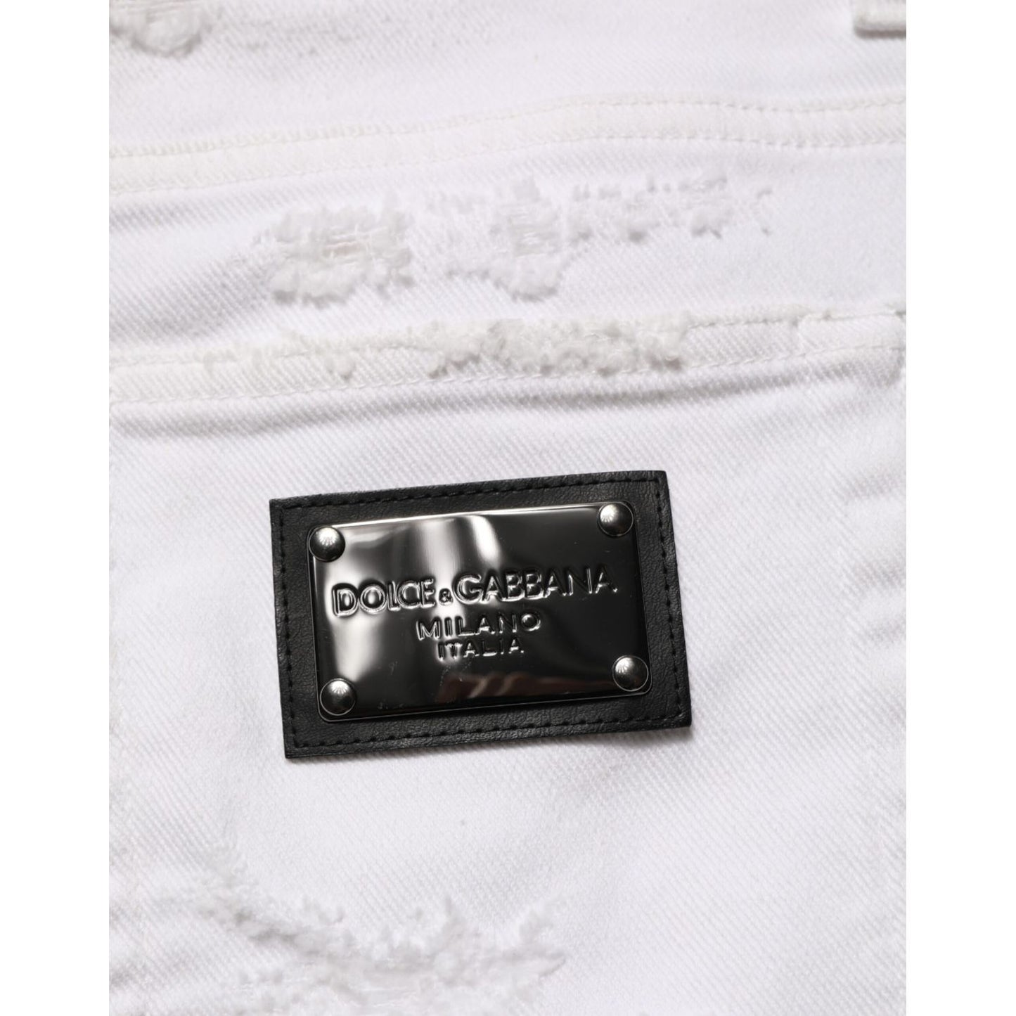 Dolce & Gabbana White Distressed Ripped Denim Trouser Jeans with metal brand logo patch detail.