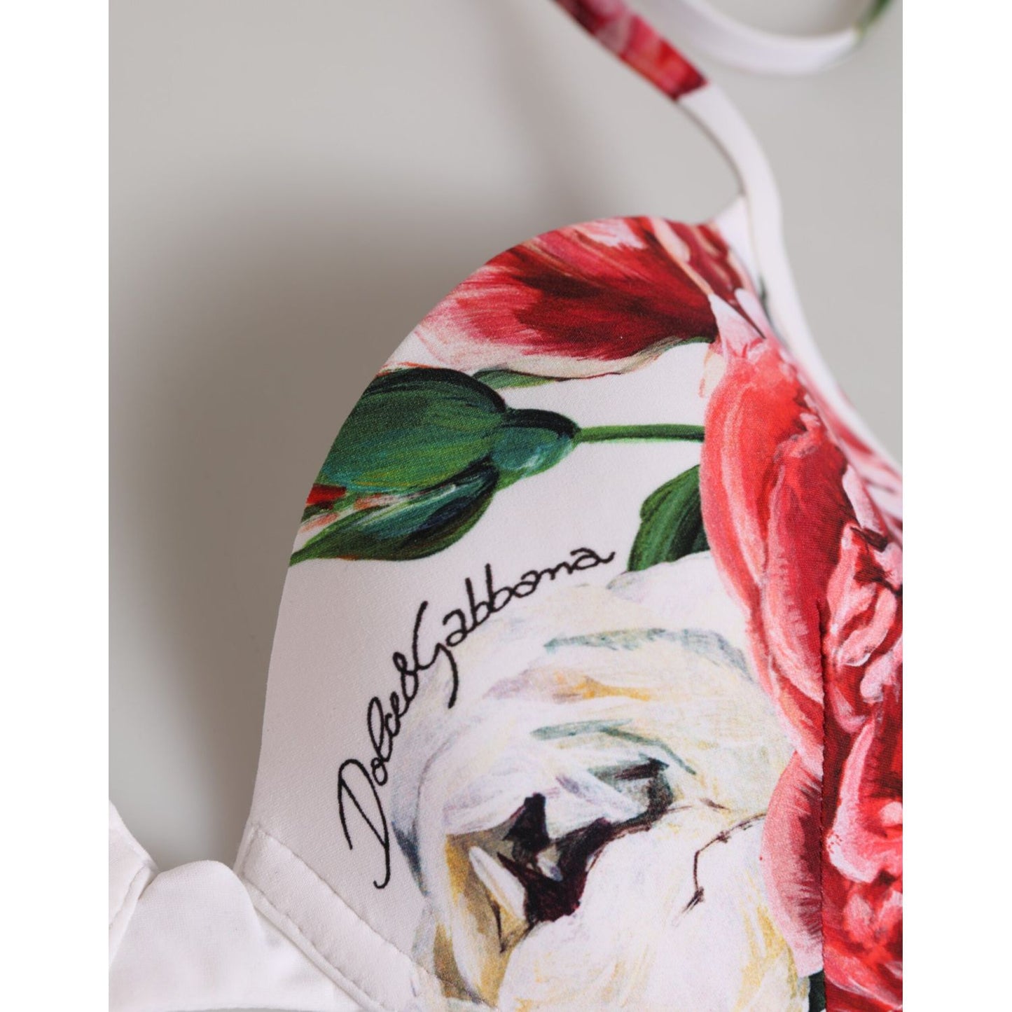 Dolce & Gabbana White Floral Print Halter Bikini Top Swimwear with vibrant floral design and logo detail.