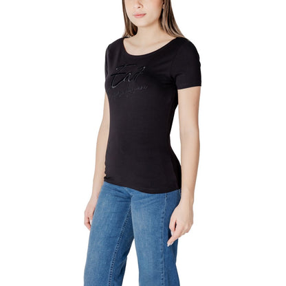 Woman wearing EA7 Emporio Armani Black Cotton T-Shirt with jeans, showcasing modern design and comfort.