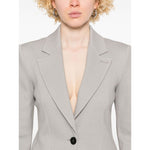 Emporio Armani Icon Blazer in light grey with button fastening, two side pockets, and shoulder pads, modeled by person wearing size 40 IT.
