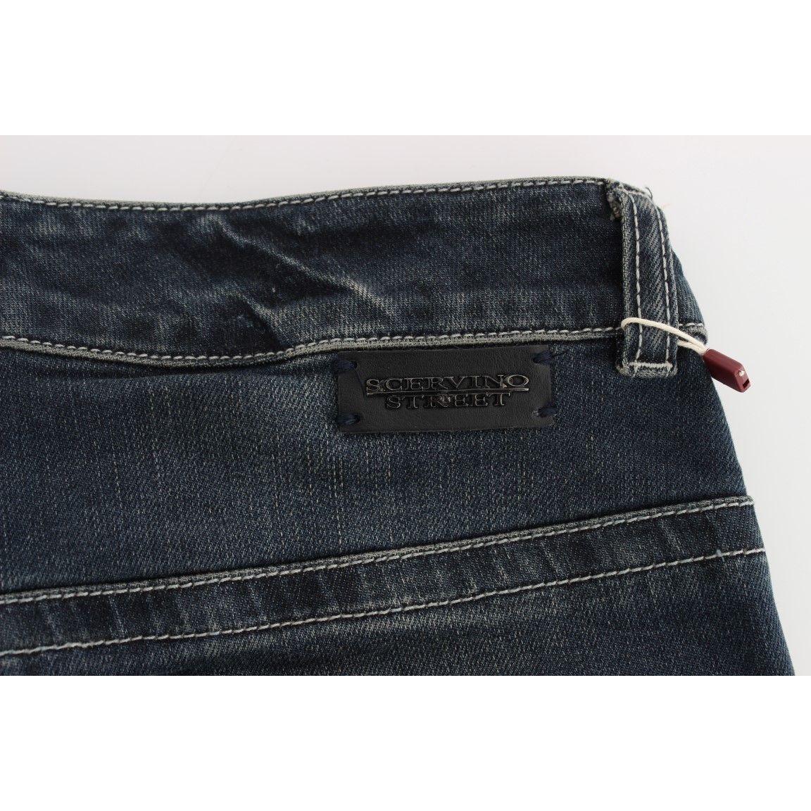 Close-up of Ermanno Scervino Blue Cotton Blend Slim Fit Jeans with tag and detailed stitching.
