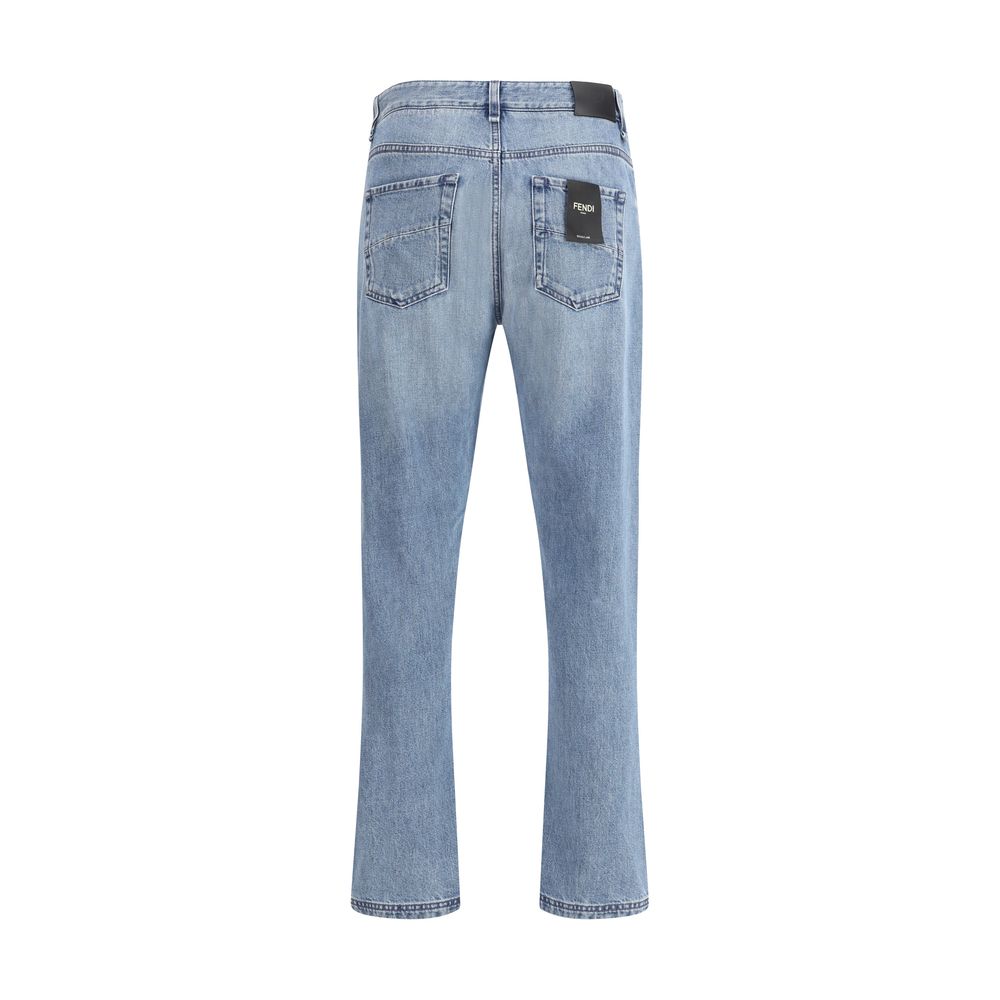 Rear view of Fendi Light Blue Cotton Straight-Leg Jeans showcasing classic 5-pocket design and iconic details. Slim fit, 100% cotton.