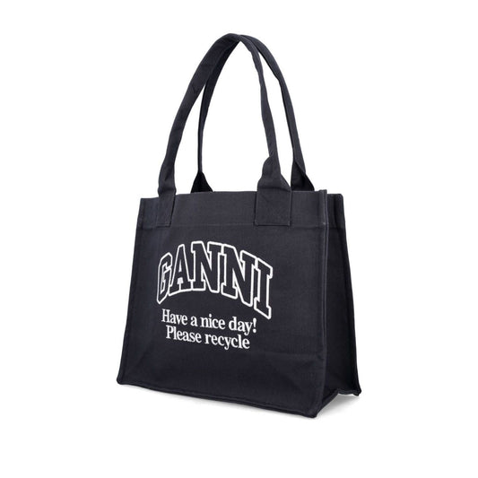 Ganni Organic cotton large tote bag in black with "Have a nice day! Please recycle" text, made from at least 50% organic materials.