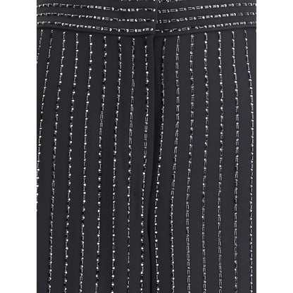 Close-up of Giorgio Armani Black Silk Casual Pants featuring embroidery and sequins on pinstripe pattern, showcasing elegance and sophistication.