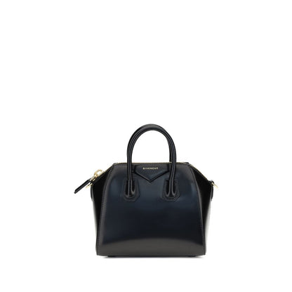 Alt Tag: Givenchy Black Calf Leather Bos Taurus Handbag with geometric pattern and iconic monogram, featuring a glossy finish and dual handles.