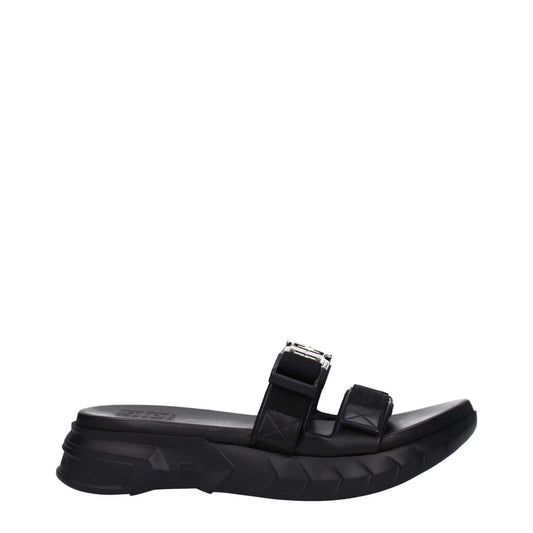 Givenchy Black Fabric Slippers featuring open toe and mid heels, silver logo, rubber sole, and clip closure.