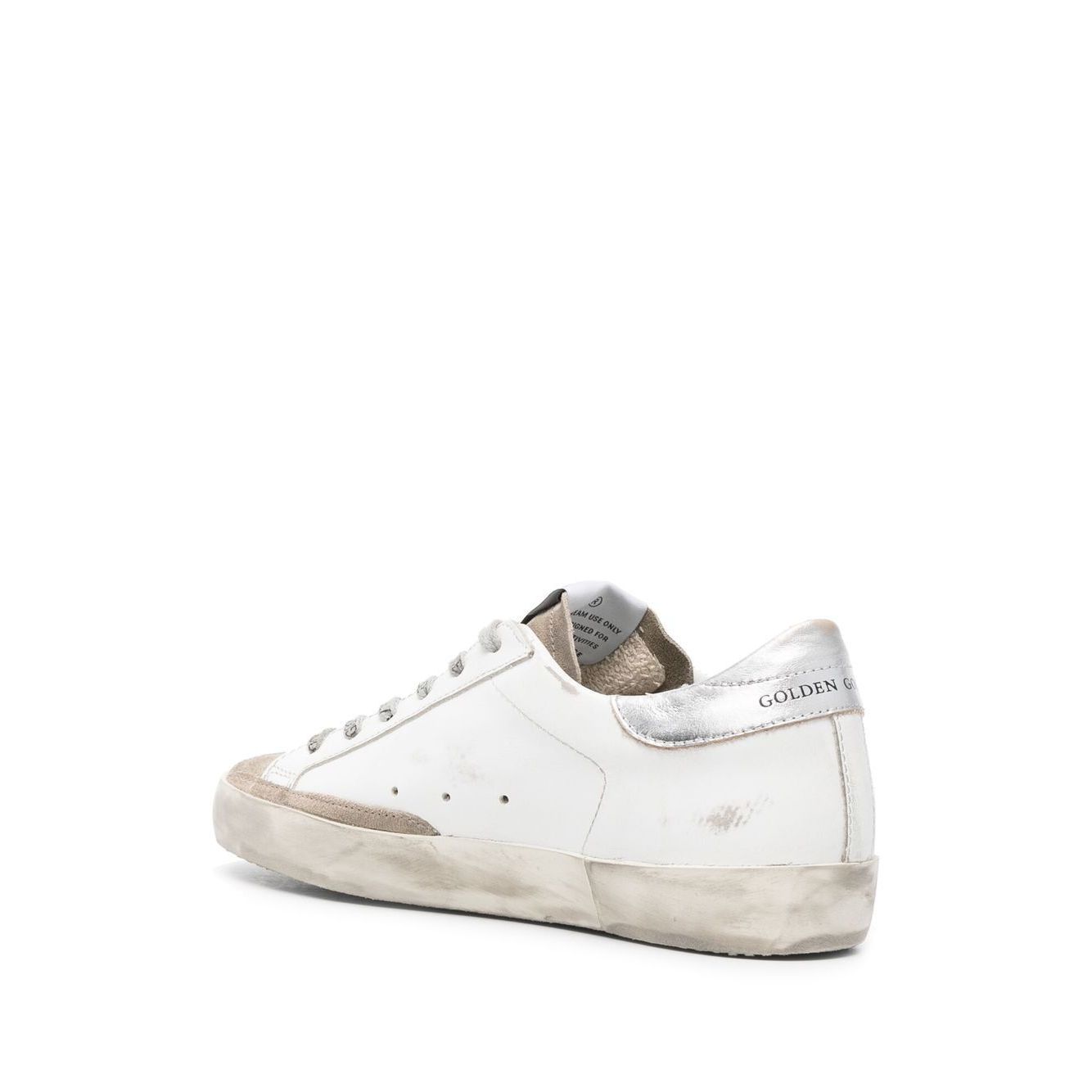 Golden Goose Super Star low-top sneaker with metallic heel and star patch, featuring cloud white leather and flat rubber sole.