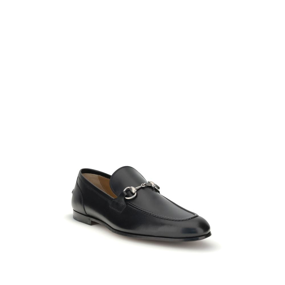 Gucci Black Calf Leather Bos Taurus Slip-On Loafers with iconic Morsetto detail and embossed logo, elegant design for formal and casual wear.
