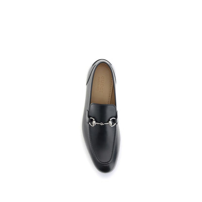 Top view of Gucci Black Calf Leather Bos Taurus Slip-On Loafers with metallic Morsetto embellishment.