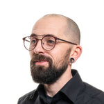 Man wearing Guess Red Men Glasses Frame, metal aviator style, full-rim design, spring hinges, with demo plastic lenses.