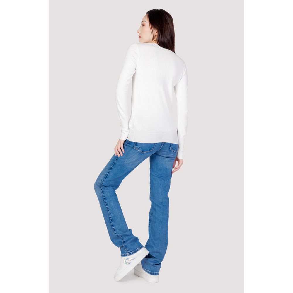 Rear view of woman wearing Guess White Cotton Sportswear, fall/winter collection, featuring 100% cotton jersey and jeans, casual style.