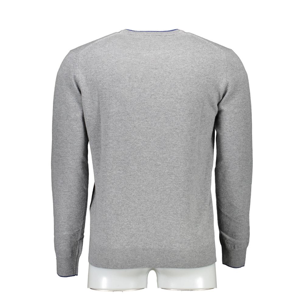Back view of gray wool sweater, showcasing long sleeves and crew neck design for stylish men.