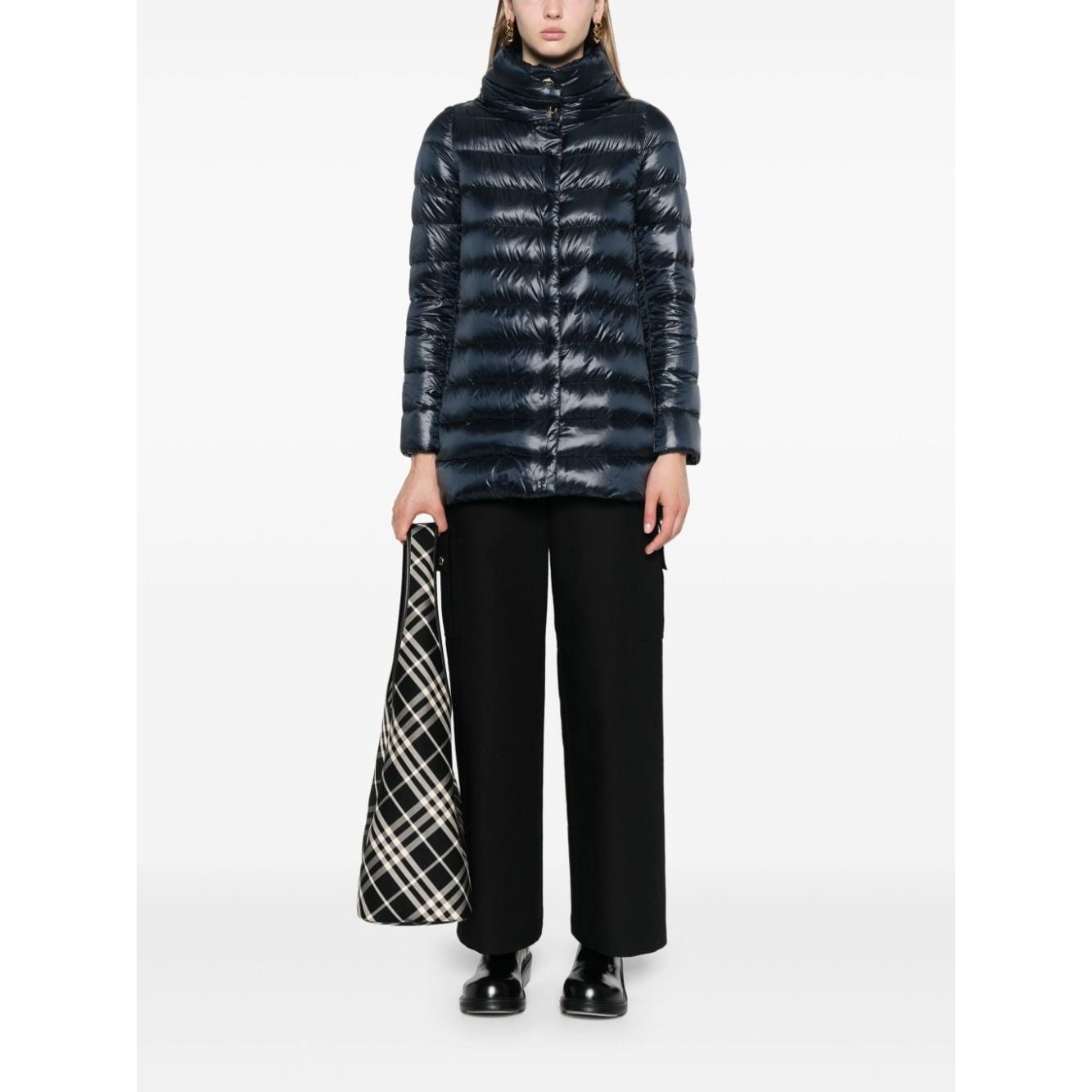 Woman wearing Herno Coats Blue navy quilted down jacket with funnel neck and two handwarmer pockets, styled with press-stud fastening.