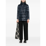 Woman wearing Herno Coats Blue navy quilted down jacket with funnel neck and two handwarmer pockets, styled with press-stud fastening.