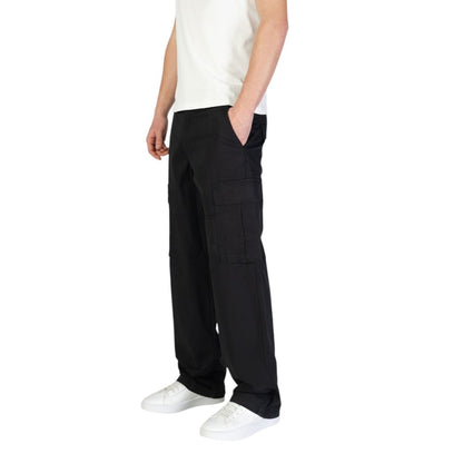 Model wearing Jack Jones Black Cotton Cargo Pants with side flap pockets, showcasing comfort and style in a casual outfit.