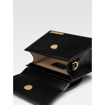 Jacquemus Le Chiquito Moyen Black Bag open showing interior and logo with gold hardware and magnetic flap closure.