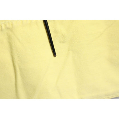 Close-up of Jeckerson Yellow Mid Waist Straight Fit Men Denim Trouser Jeans fabric texture.