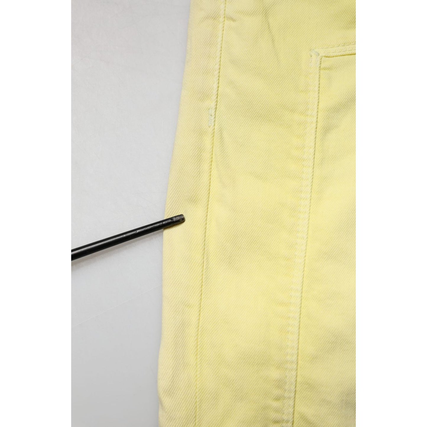 Close-up of Jeckerson Yellow Mid Waist Straight Fit Men Denim Trouser Jeans showcasing fabric texture and stitching.