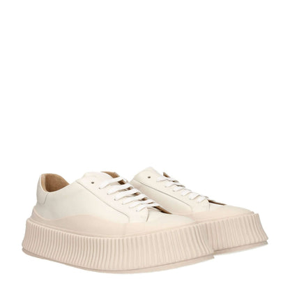 Jil Sander Beige Leather Platform Sneakers with lace-up closure, aged effect, rubber sole, 5 cm wedge heel, and round toe design.
